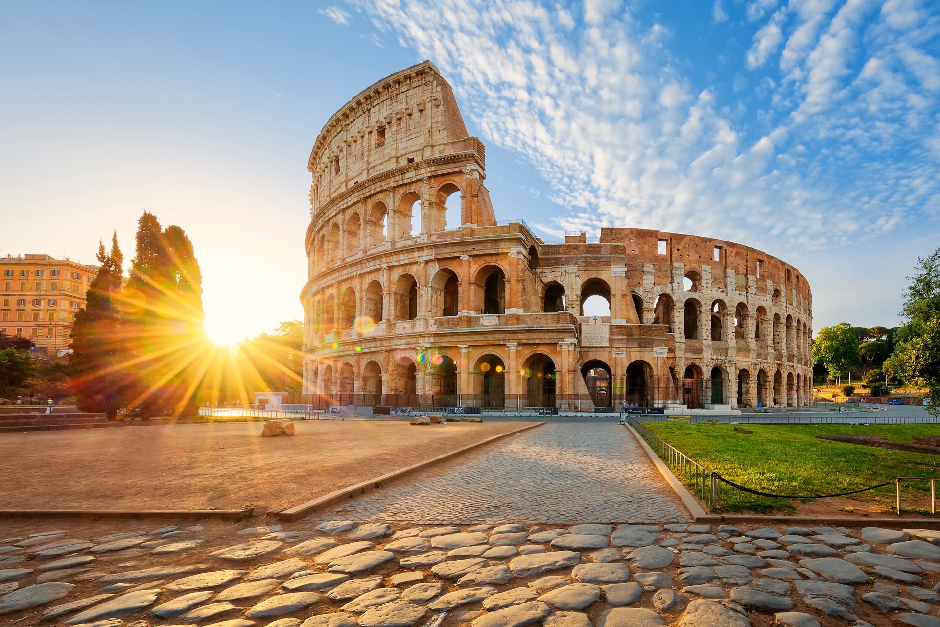 Colosseum in Rome and morning sun, Italy